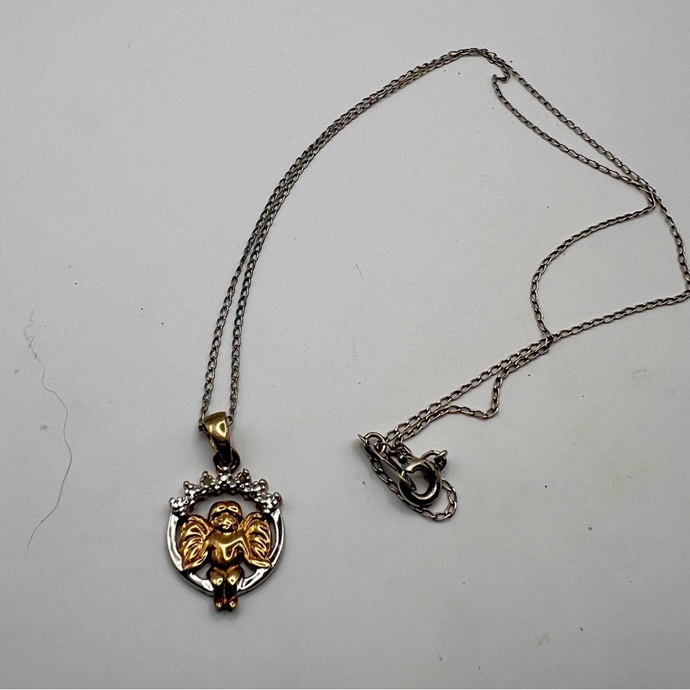 Angel Pendant marked RJ 925 Thailand on a 925 marked sterling chain